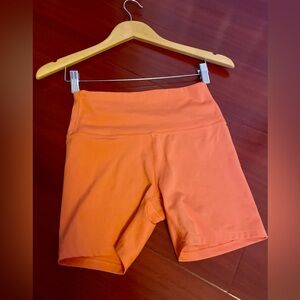 all in motion Orange High-Rise Bike Shorts